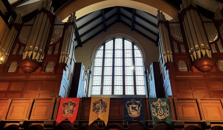 Banners representing the four houses from the Harry Potter franchise hang from the organ. Photo courtesy of Sander J. Schipper